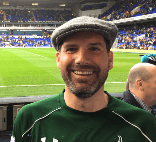 Board member Micheal pitch side at White Hart Lane.